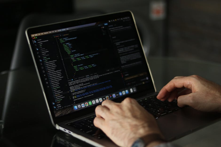 A close-up photograph of a computer screen displaying lines of HTML code in a code editor. The code includes tags such as <!DOCTYPE html>, <html>, <head>, <meta>, and <title>, with some attributes vis